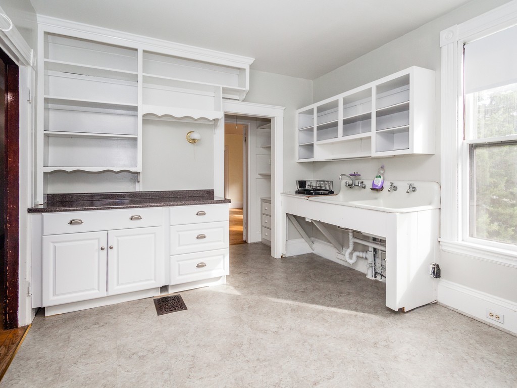 46 Gorham Avenue Brookline, MA 02445 - Photo 2 of 23 a room with a cabinets and a dresser