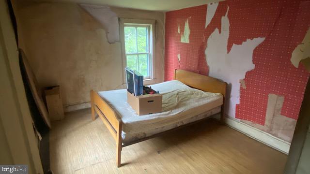201 Hoover Road Robertsdale, PA 16674 - Photo 27 of 55 a bedroom with a bed and a window