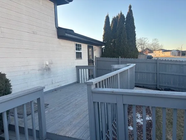 a view of balcony with furniture