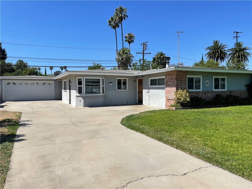 5572 Norman Way Riverside, CA 92504 - Photo 1 of 1 a front view of a house with a garden