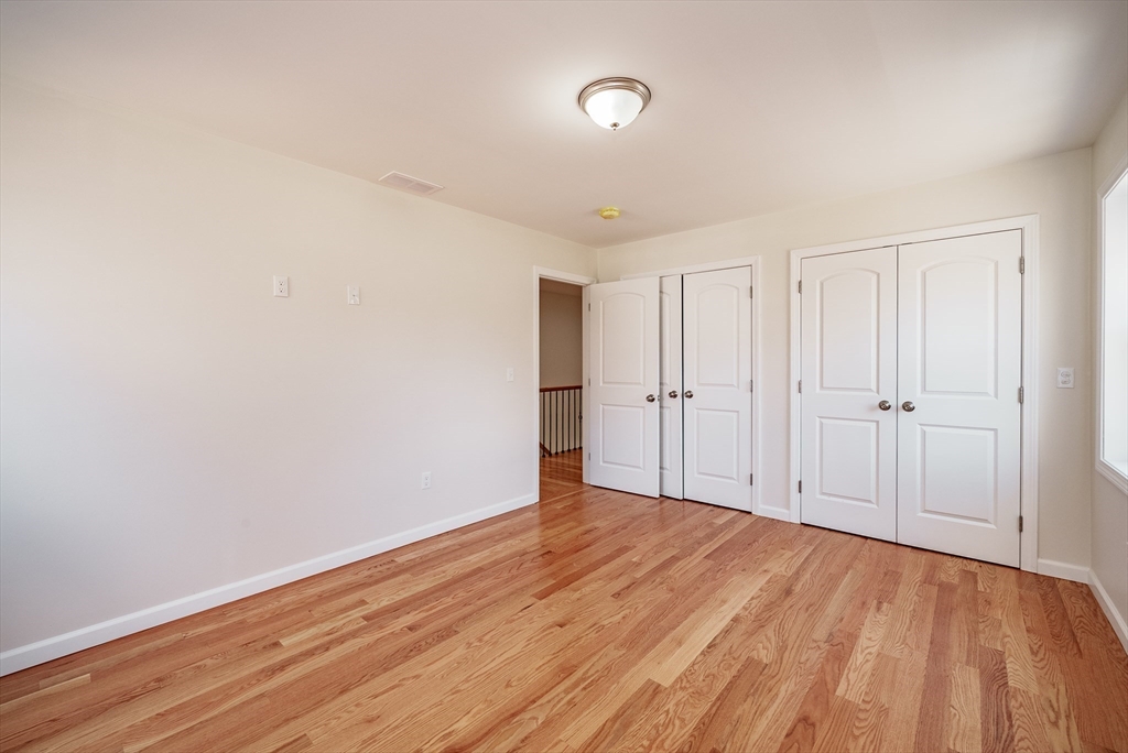 74 West Crystal Brook Drive Springfield, MA 01118 - Photo 13 of 31 a view of an empty room with wooden floor