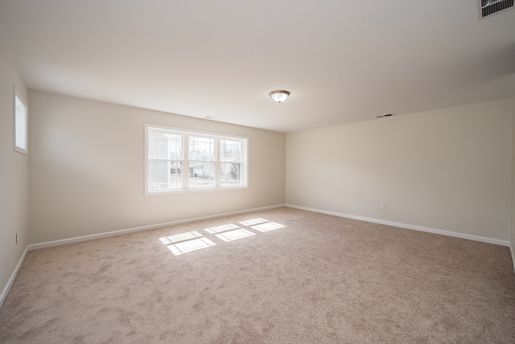 74 West Crystal Brook Drive Springfield, MA 01118 - Photo 24 of 31 an empty room with windows