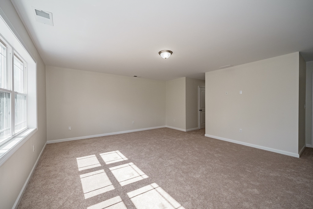 74 West Crystal Brook Drive Springfield, MA 01118 - Photo 25 of 31 an empty room with windows