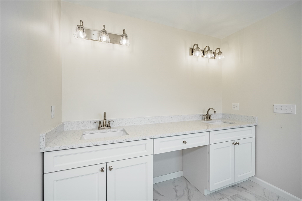 74 West Crystal Brook Drive Springfield, MA 01118 - Photo 28 of 31 a bathroom with a sink and a mirror