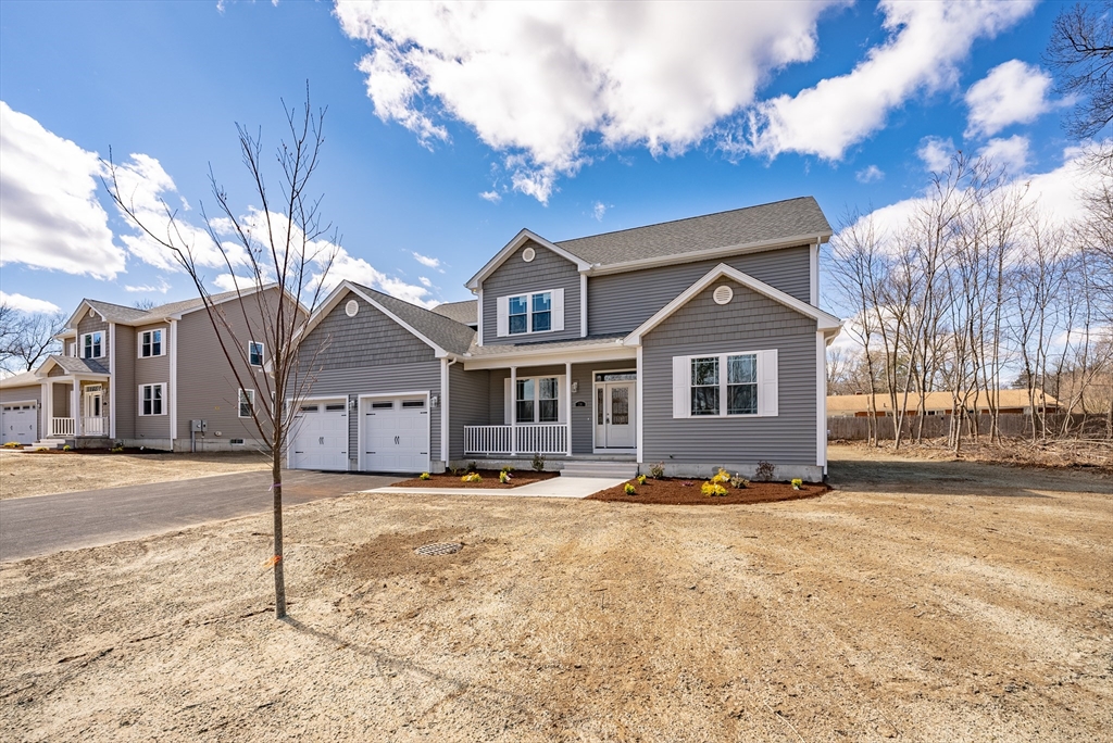 74 West Crystal Brook Drive Springfield, MA 01118 - Photo 3 of 31 a front view of a house with a yard