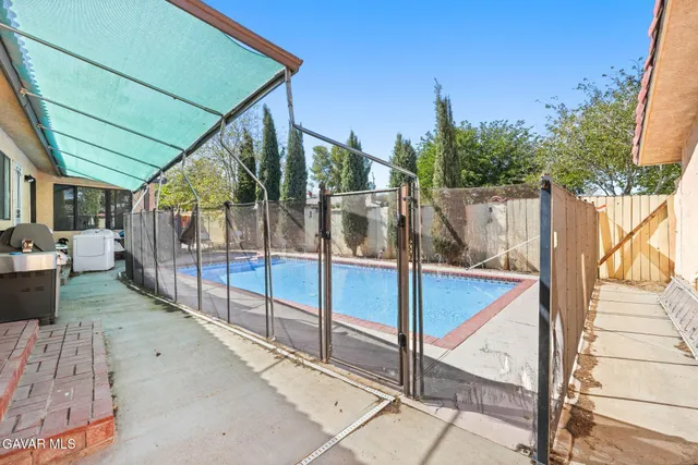 a view of a livingroom with furniture and a window