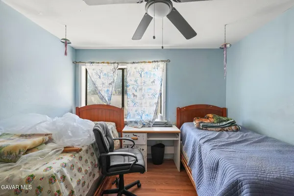 a bedroom with a bed and cabinets