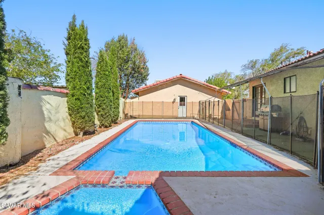 a view of a dining room with furniture and a window
