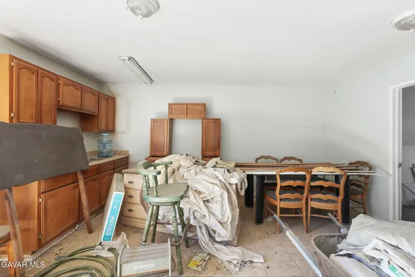 a bed room with furniture and a chair