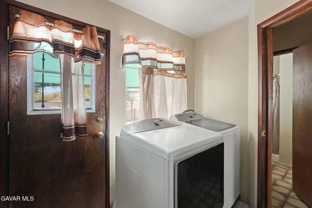 a bedroom with a bed and cabinets