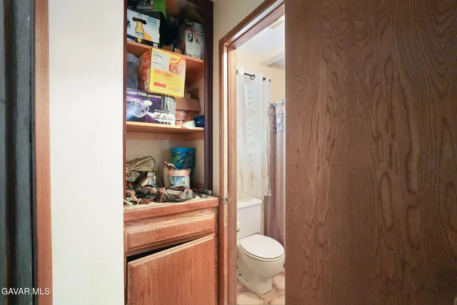 a bedroom with a bed and a table