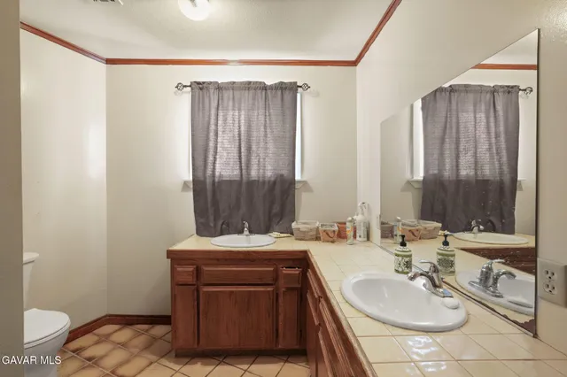 a bed room with furniture and a chair