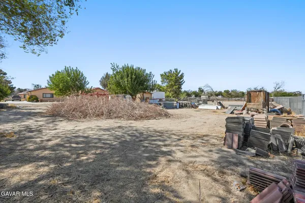 a room with a sink and a mirror