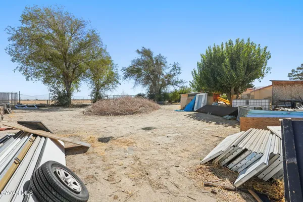 a bathroom with a sink double vanity granite and a mirror