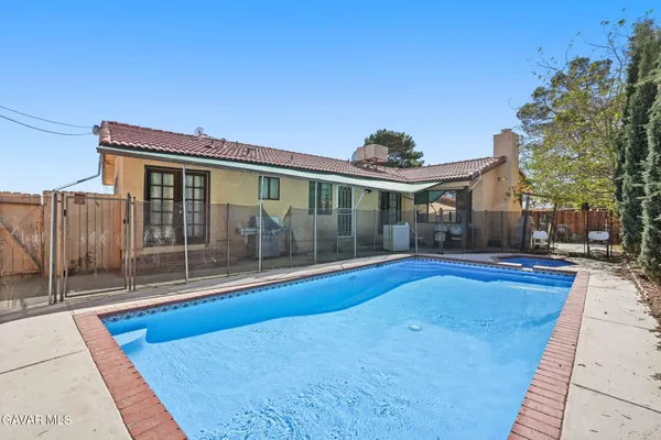 a bathroom with a toilet a sink and shower