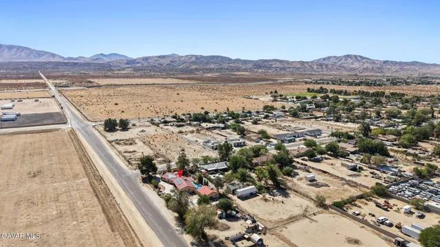 a view of a car park in front of a house