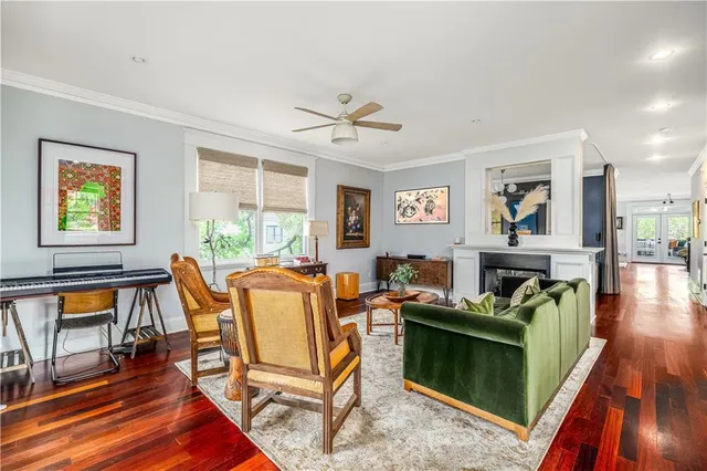 a living room with furniture a fireplace and a piano table