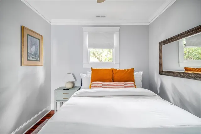 a bedroom with a large bed and a window