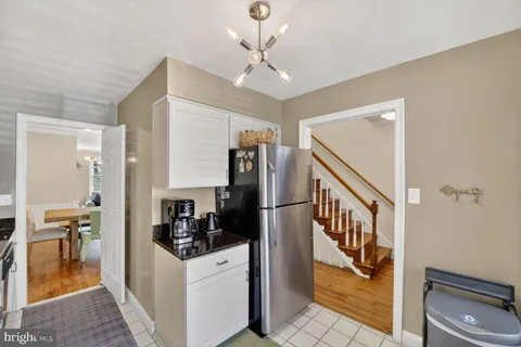 a kitchen with stainless steel appliances a refrigerator a stove a sink and a refrigerator