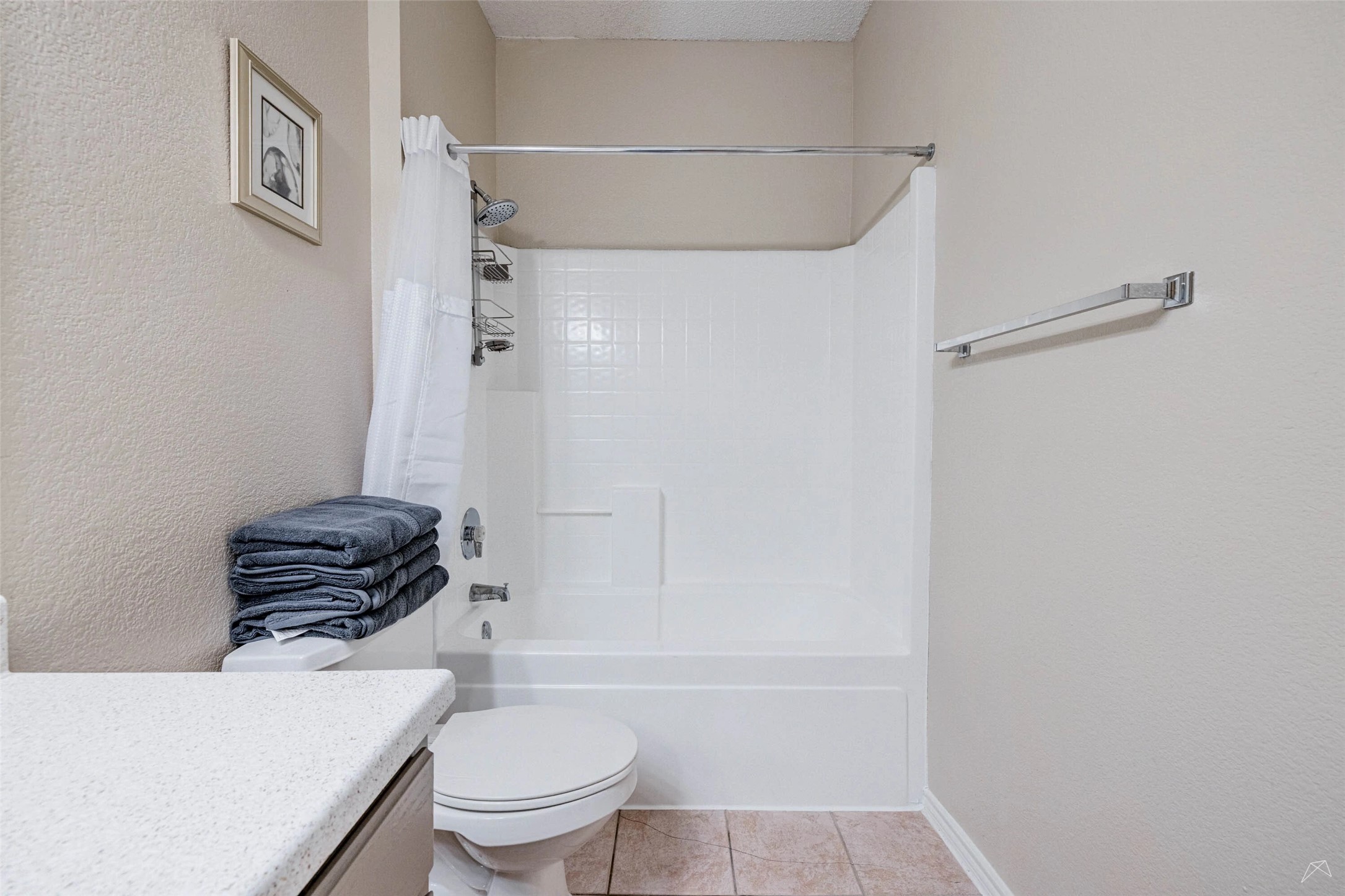 11908 Anderson Mill Road, Unit 312 Cedar Park, TX 78613 - Photo 12 of 25 a bathroom with a toilet a sink and a shower