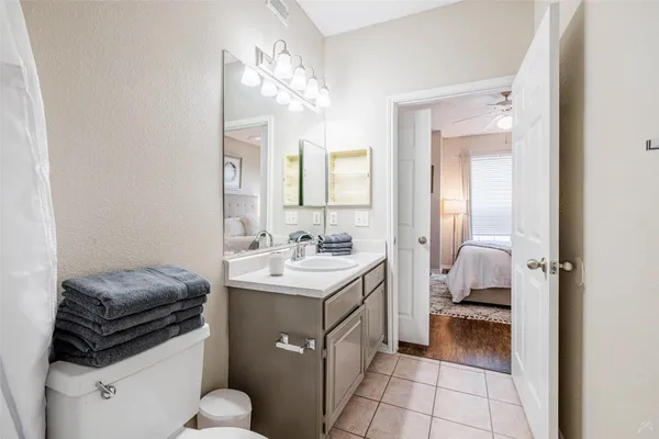 a kitchen with a sink appliances and cabinets