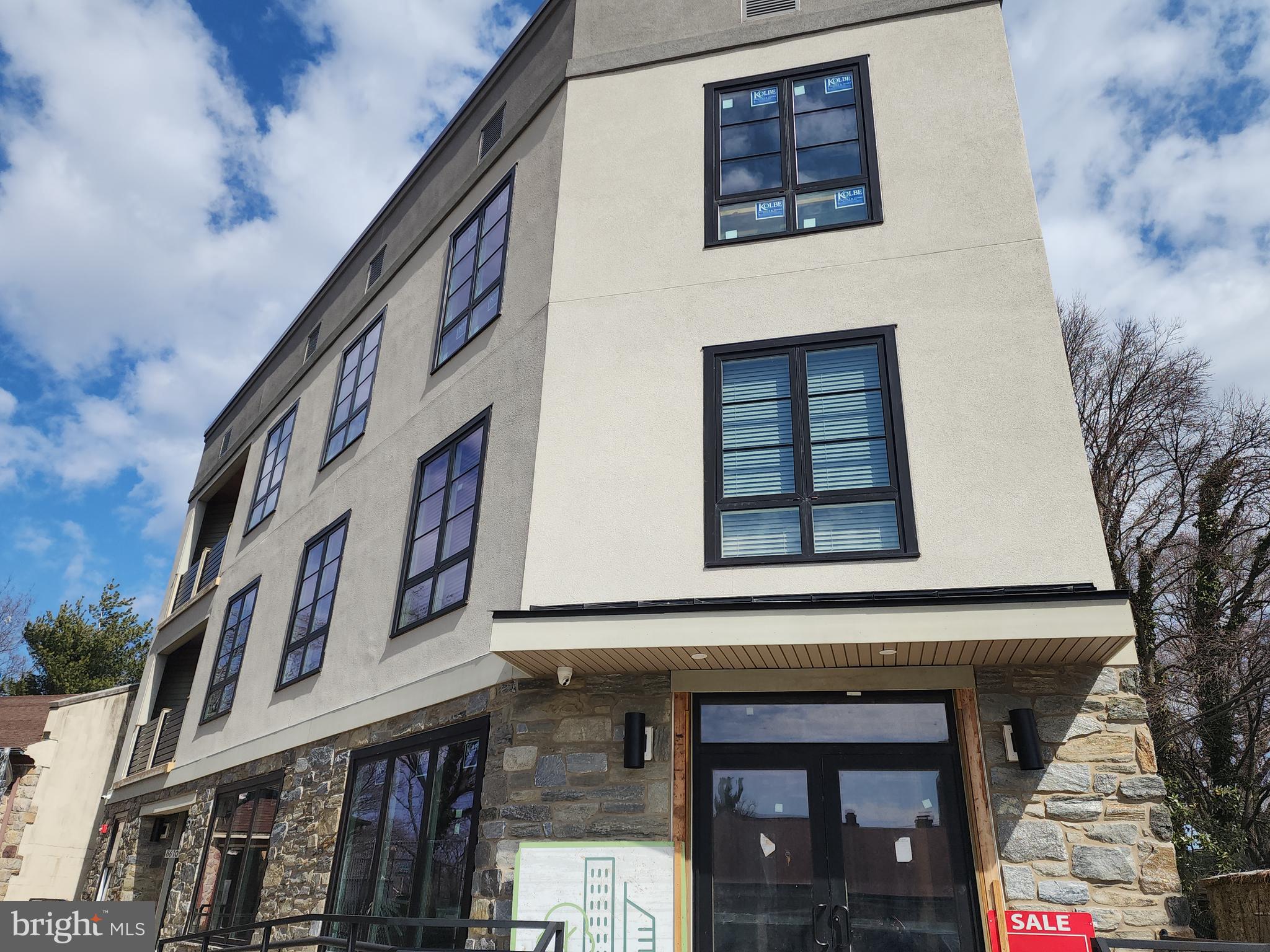 8610 Evergreen Place, Unit 100 Philadelphia, PA 19118 - Photo 1 of 21 a front view of a building