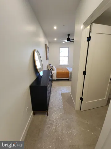 a view of closet with wooden floor