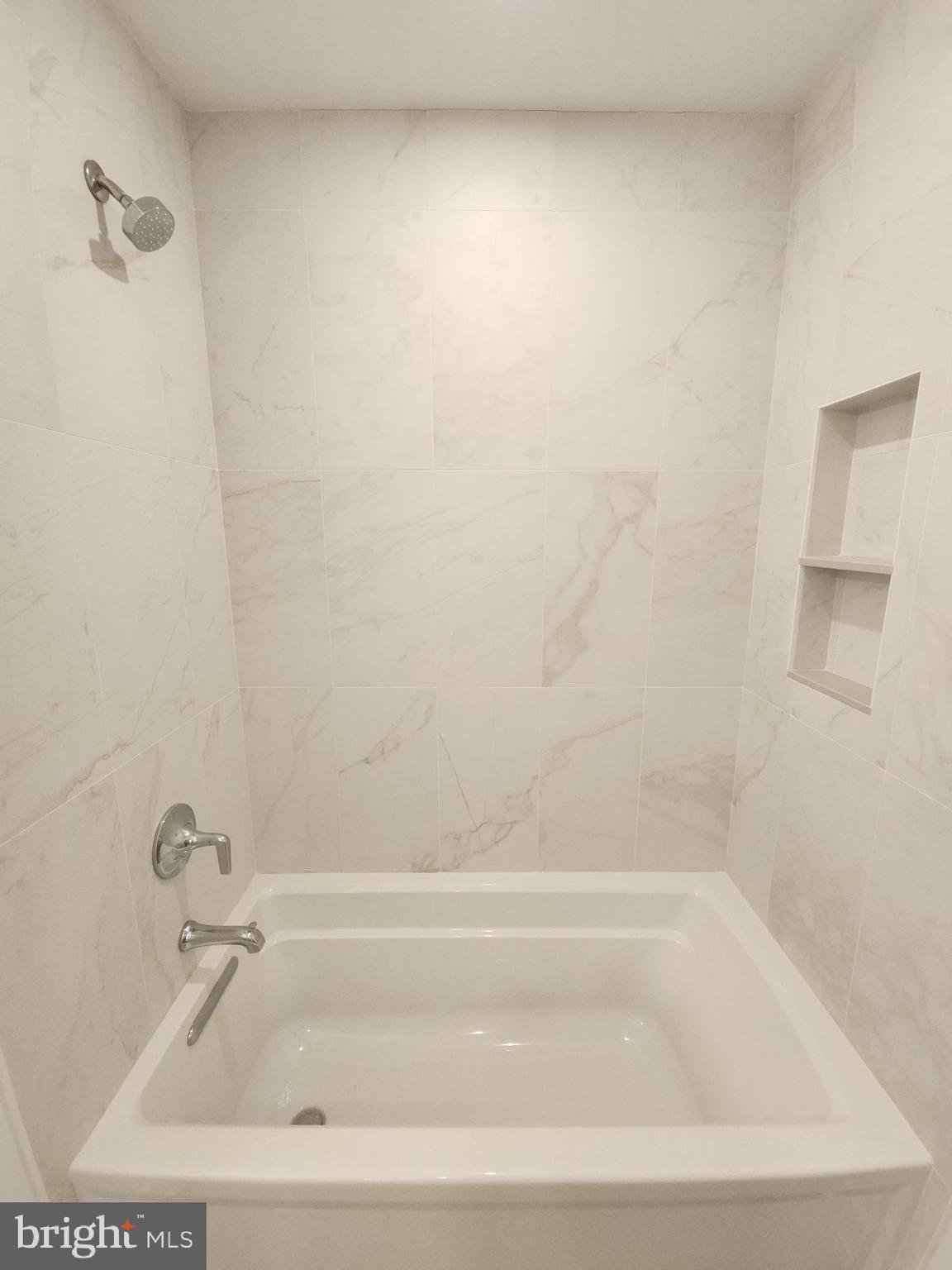 8610 Evergreen Place, Unit 100 Philadelphia, PA 19118 - Photo 20 of 21 a bathroom with a bathtub