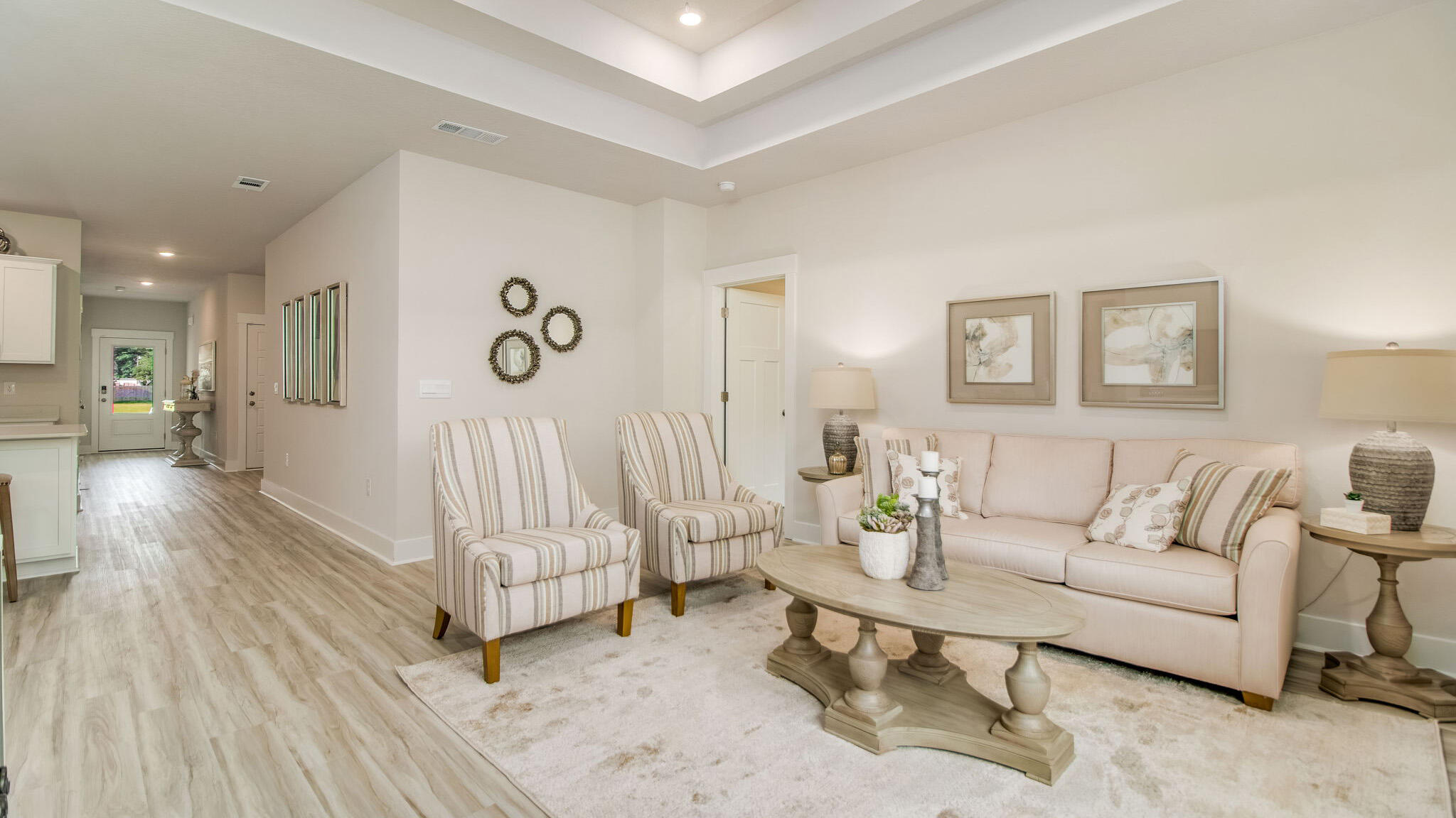 5848 Dove Nest Road Gulf Breeze, FL 32563 - Photo 10 of 32 a living room with furniture and a wooden floor