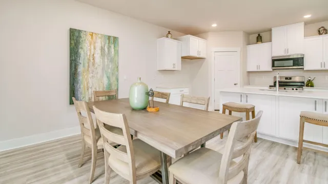 a kitchen with a sink cabinets and wooden floor