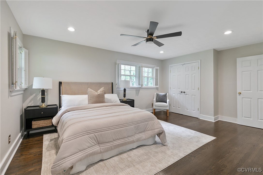 7660 Cherokee Road Richmond, VA 23225 - Photo 23 of 36 a bedroom with a bed and a chandelier