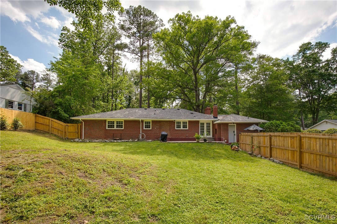 7660 Cherokee Road Richmond, VA 23225 - Photo 34 of 36 a view of a house with a yard and sitting area