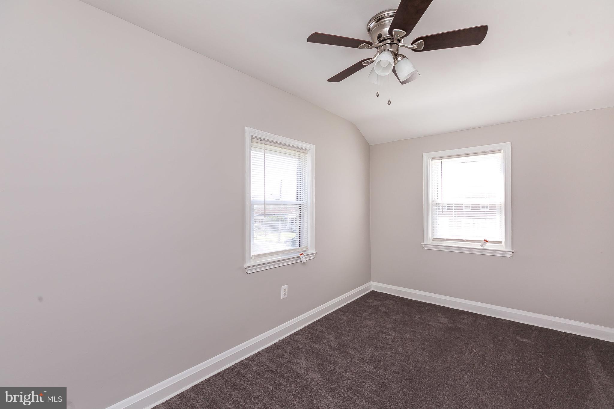 960 Middlesex Road Essex, MD 21221 - Photo 13 of 29 an empty room with a window and a fan
