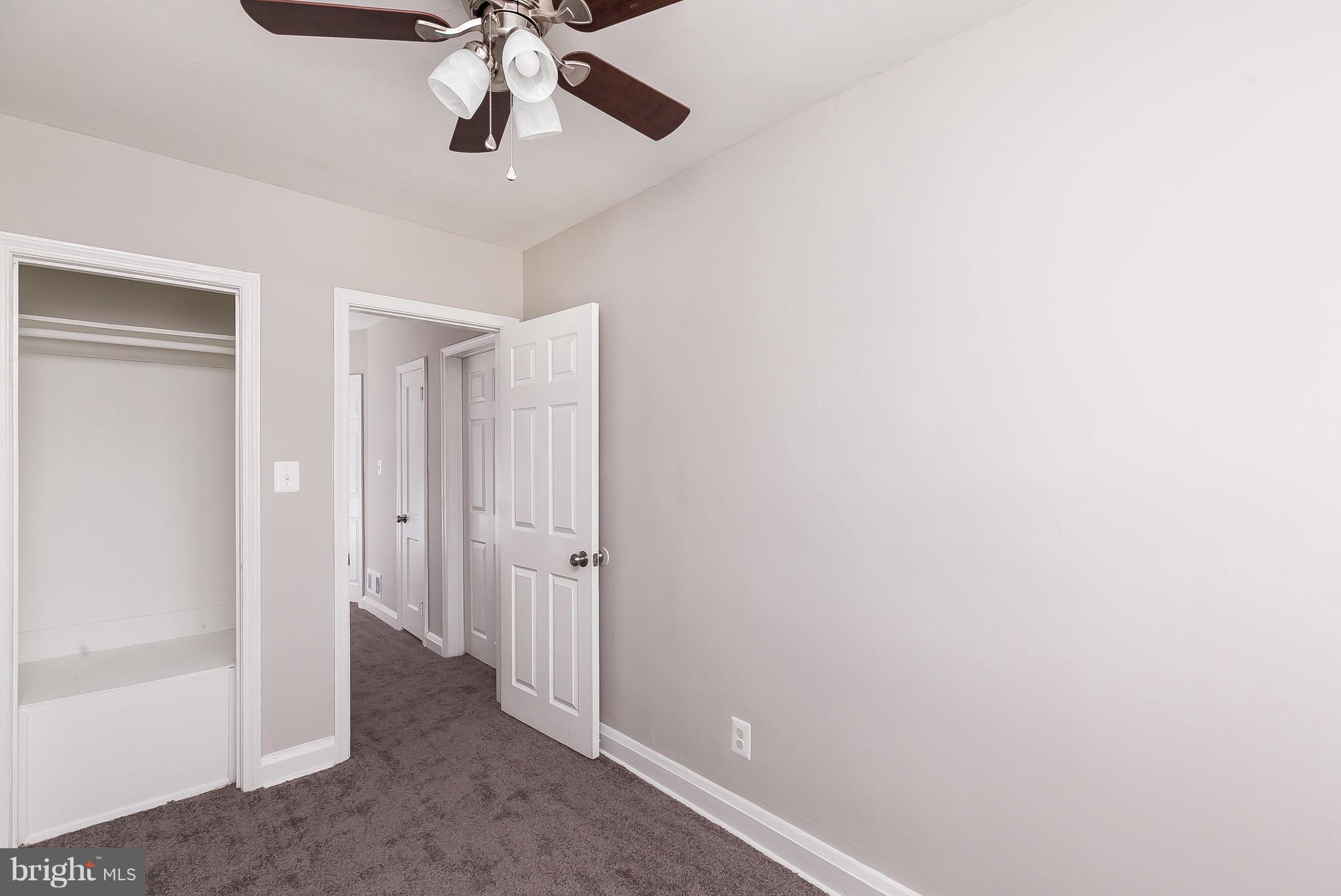 960 Middlesex Road Essex, MD 21221 - Photo 15 of 29 a view of a hallway with a chandelier fan