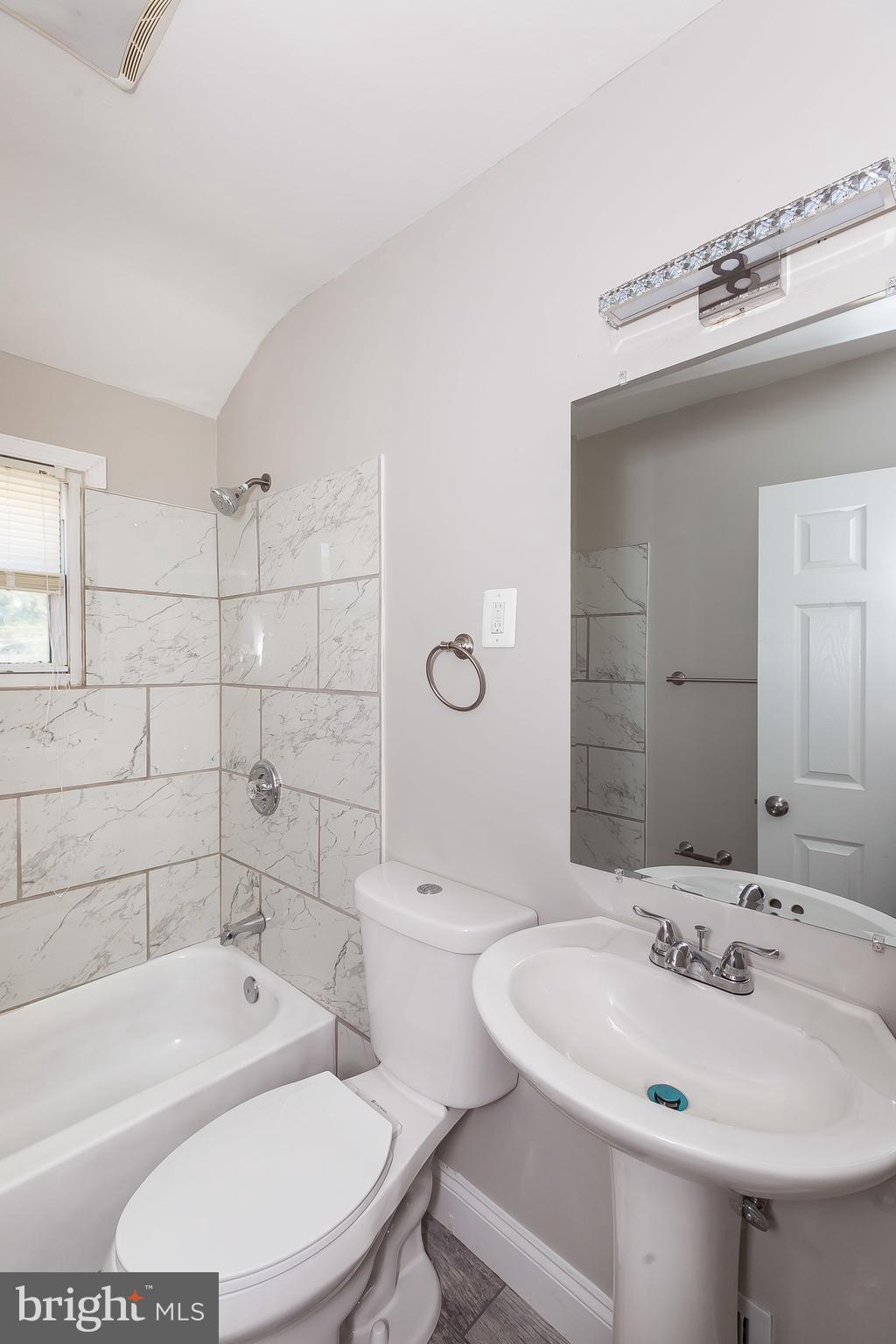 960 Middlesex Road Essex, MD 21221 - Photo 19 of 29 a bathroom with a sink a toilet and shower