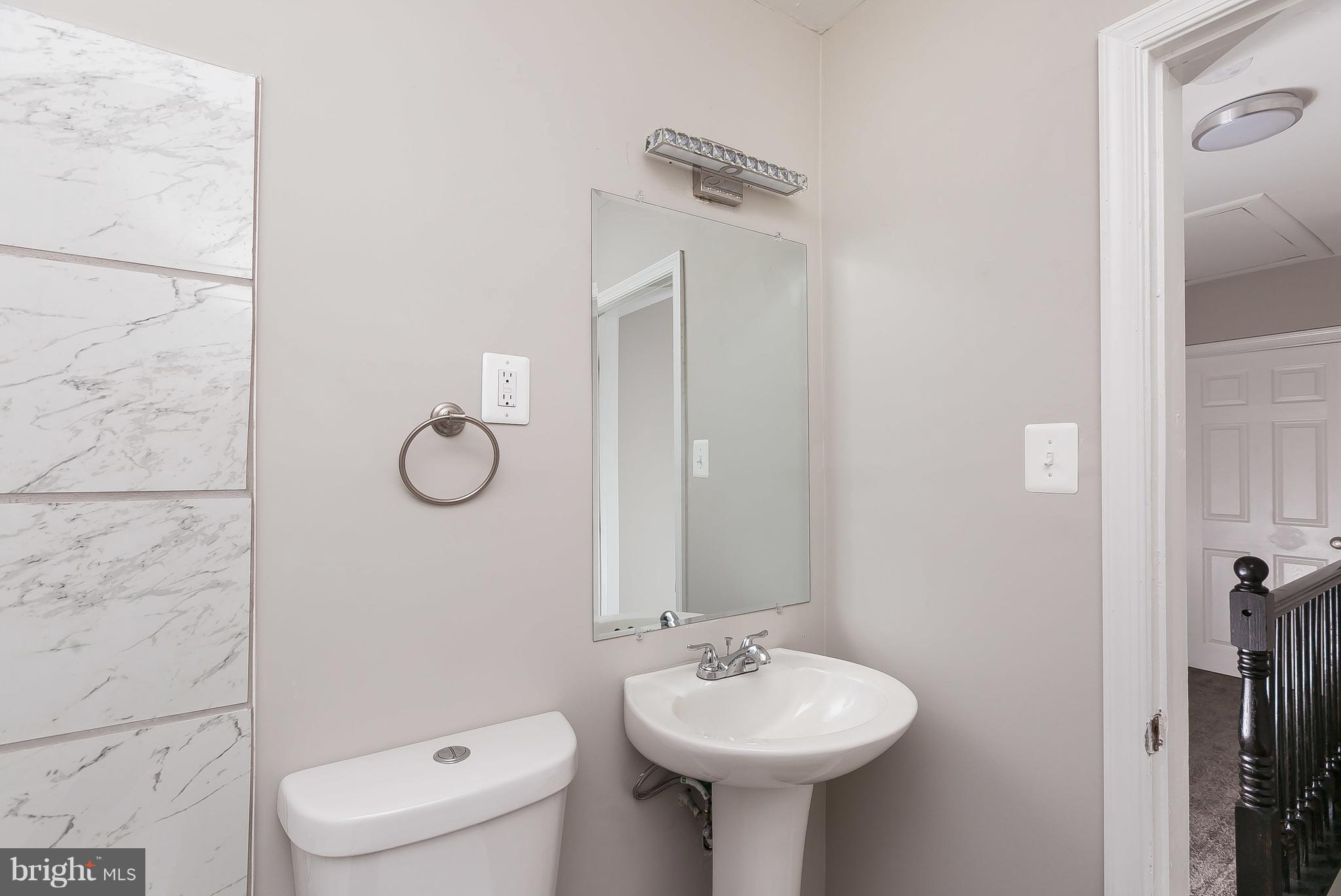 960 Middlesex Road Essex, MD 21221 - Photo 20 of 29 a bathroom with a sink toilet and shower