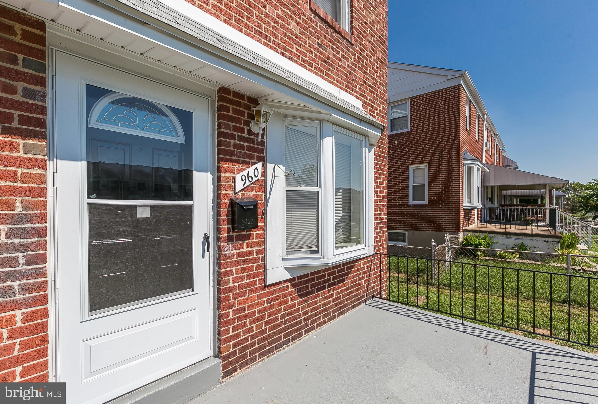 960 Middlesex Road Essex, MD 21221 - Photo 4 of 29 a view of a house with a large window and brick wall