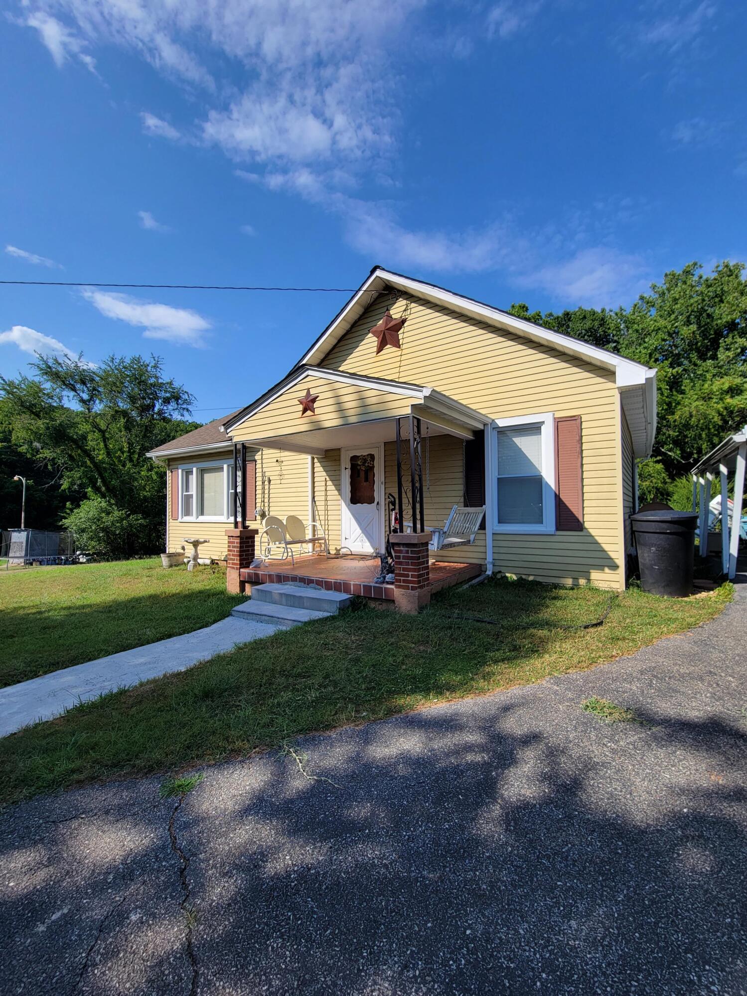 3776 Rutrough Road Southeast Roanoke, VA 24014 - Photo 1 of 12 a front view of a house with a yard