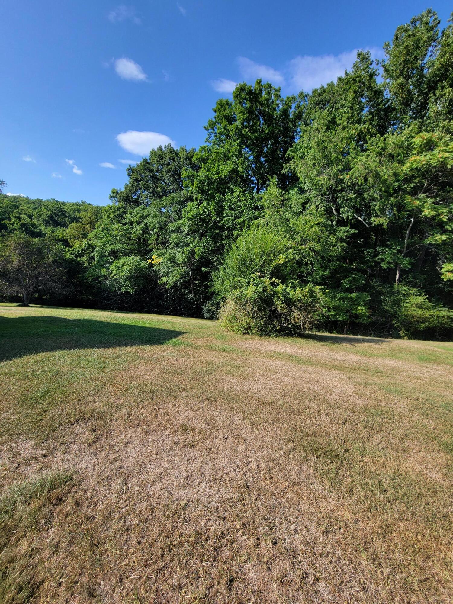 3776 Rutrough Road Southeast Roanoke, VA 24014 - Photo 12 of 12 a view of a field with trees in background