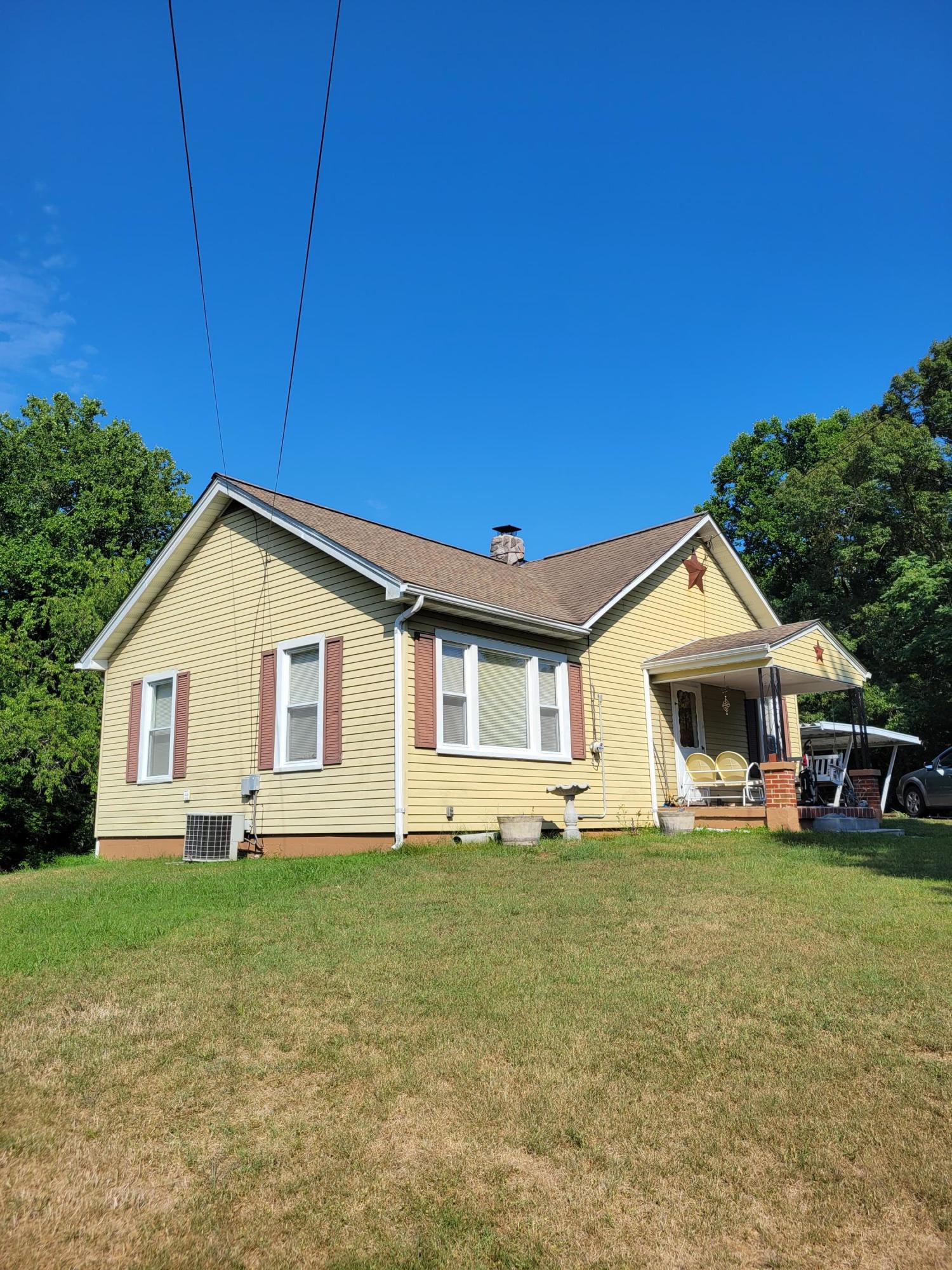 3776 Rutrough Road Southeast Roanoke, VA 24014 - Photo 3 of 12 a front view of house with yard and green space