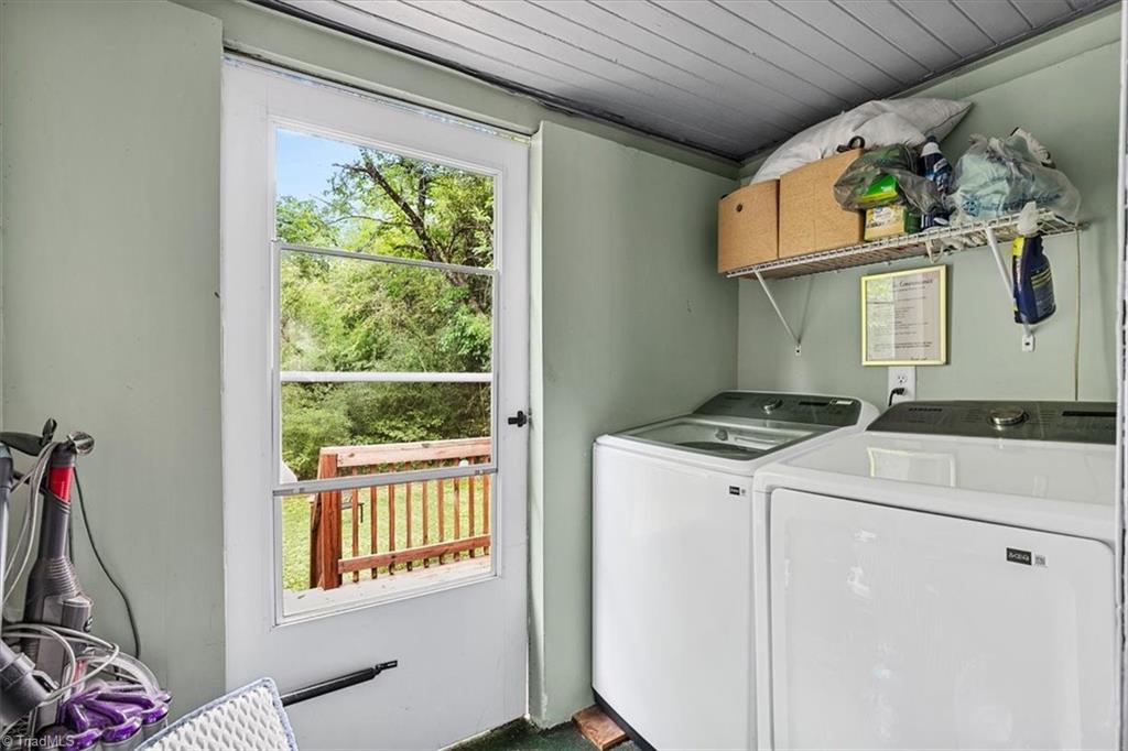 226 Friendly Avenue High Point, NC 27260 - Photo 31 of 38 A dedicated laundry room with full size washer and dryer connections and a window view of the backyard, supporting a busy shared household.
