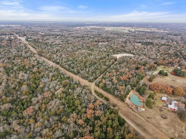 an aerial view of house with yard