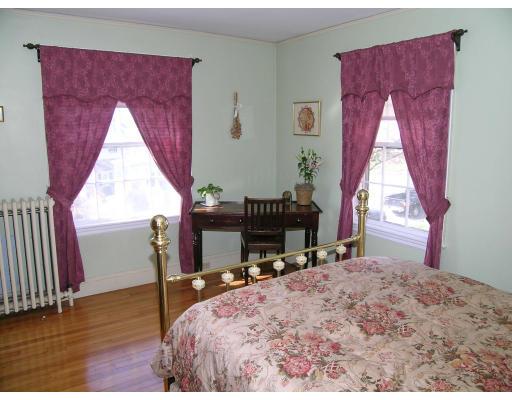 33 Gale Road Belmont, MA 02478 - Photo 7 of 13 a bed sitting in a bedroom next to a window