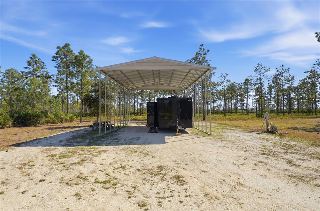 6844 Chad Jason Road St. Cloud, FL 34773 - Photo 49 of 59 a view of a swimming pool with a patio