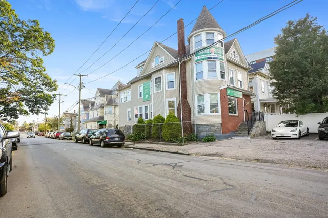 a view of a house with a yard