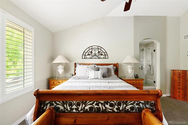 a view of a livingroom with furniture and a ceiling fan