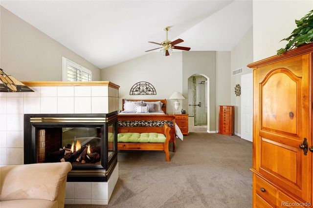 a bed room with furniture and a window