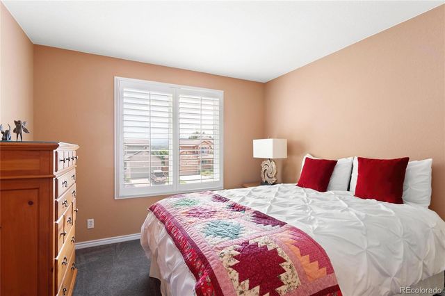 a bedroom with bed and a window