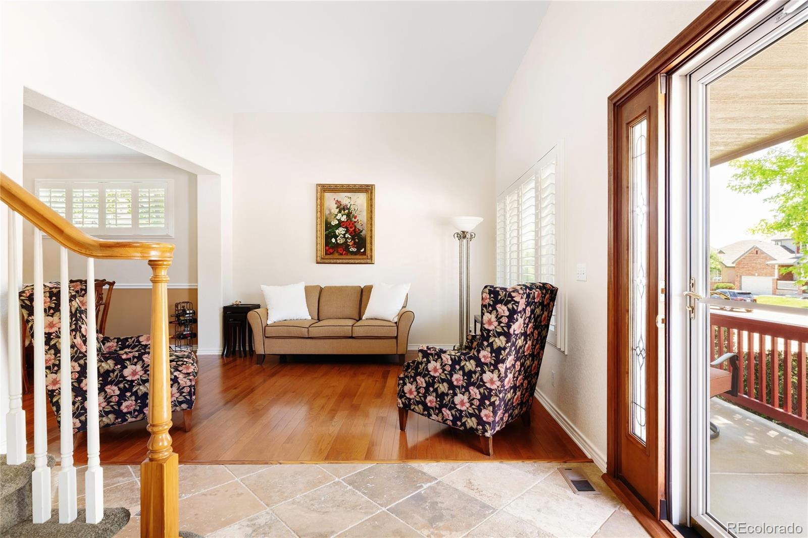 10523 West Peakview Place Littleton, CO 80127 - Photo 3 of 40 a living room with furniture and a large window