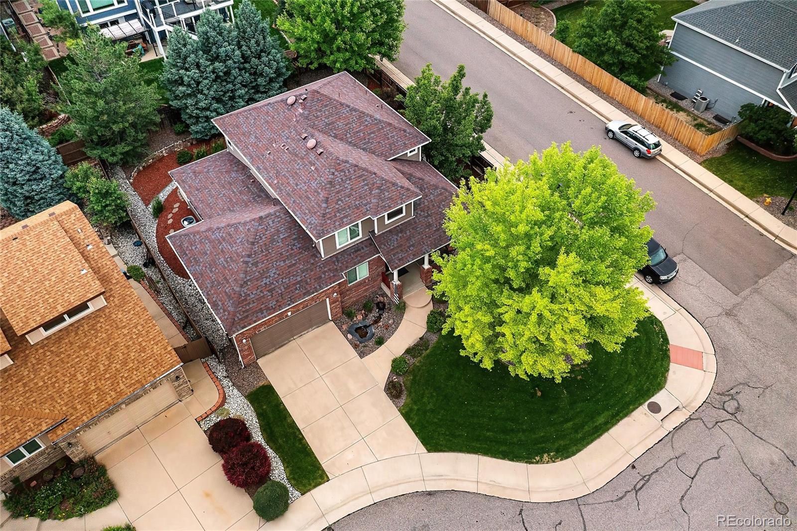 10523 West Peakview Place Littleton, CO 80127 - Photo 36 of 40 an aerial view of a house with a yard and plants
